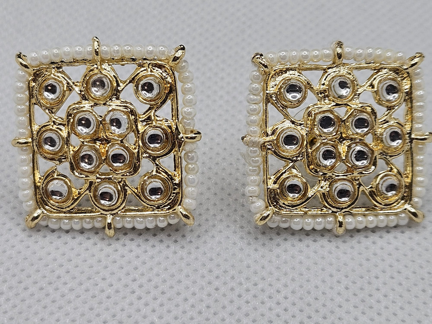 Gold Polish Brass Alloy White Pearl And Kundan Stud Earrings